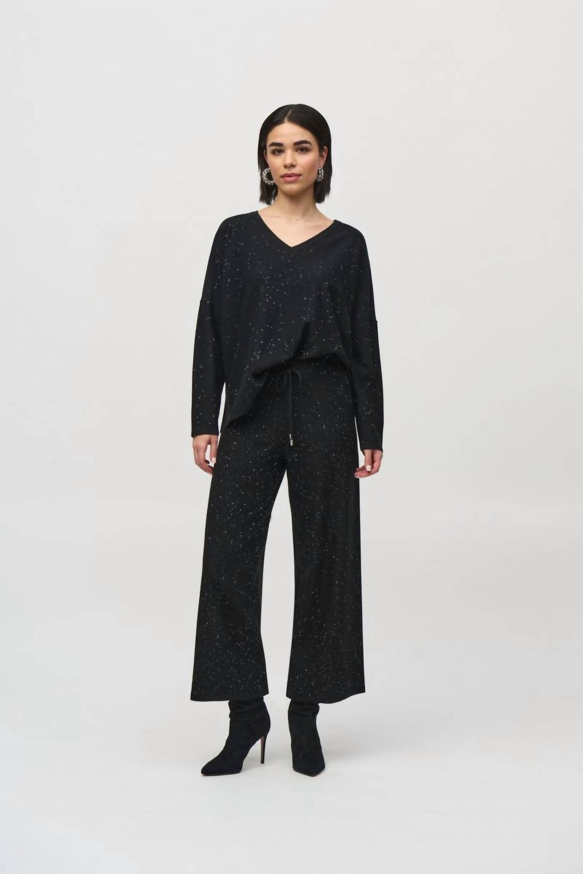 Top de mujer de manga larga con lentejuelas color negro