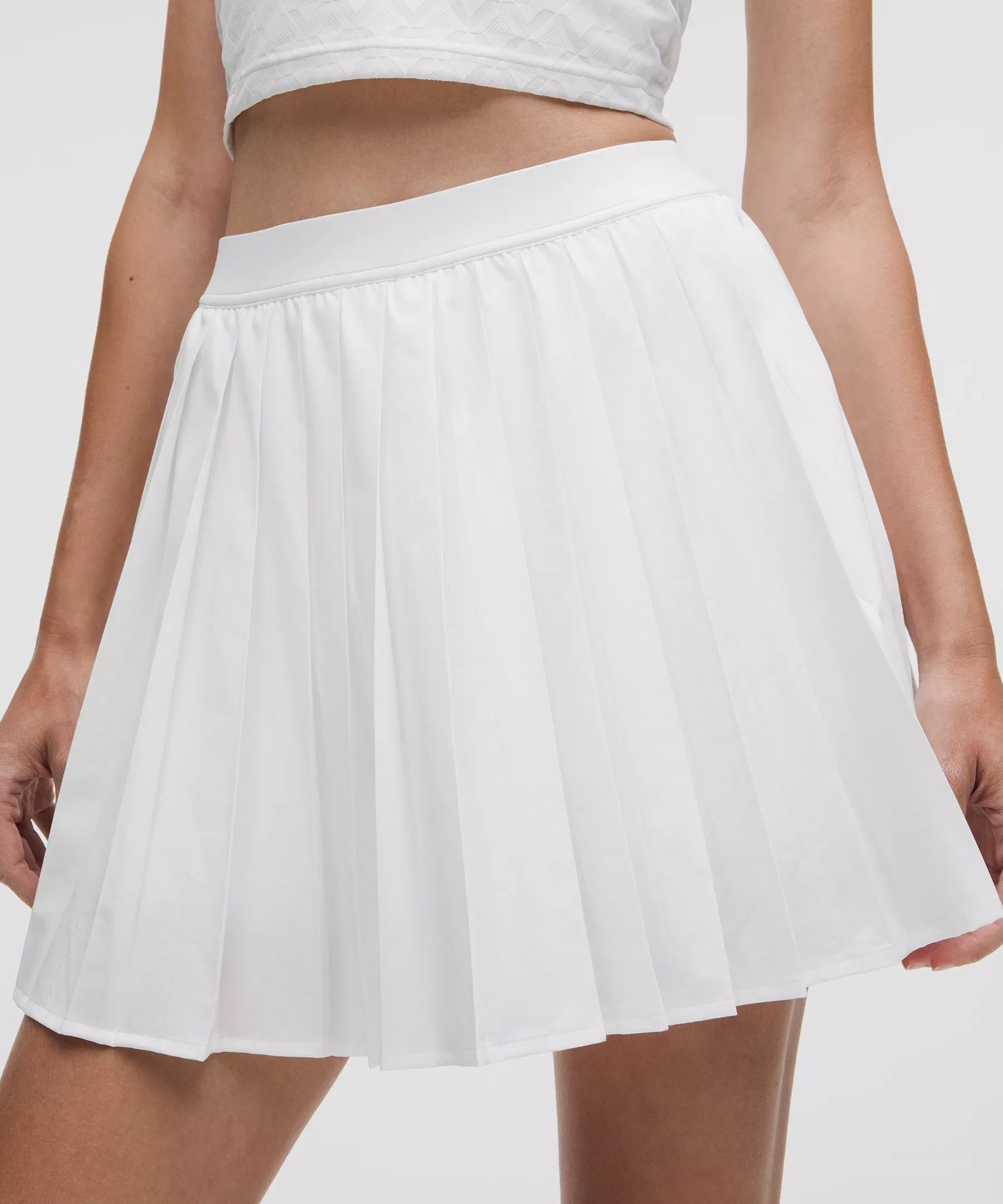 Falda de tiro alto con pliegues