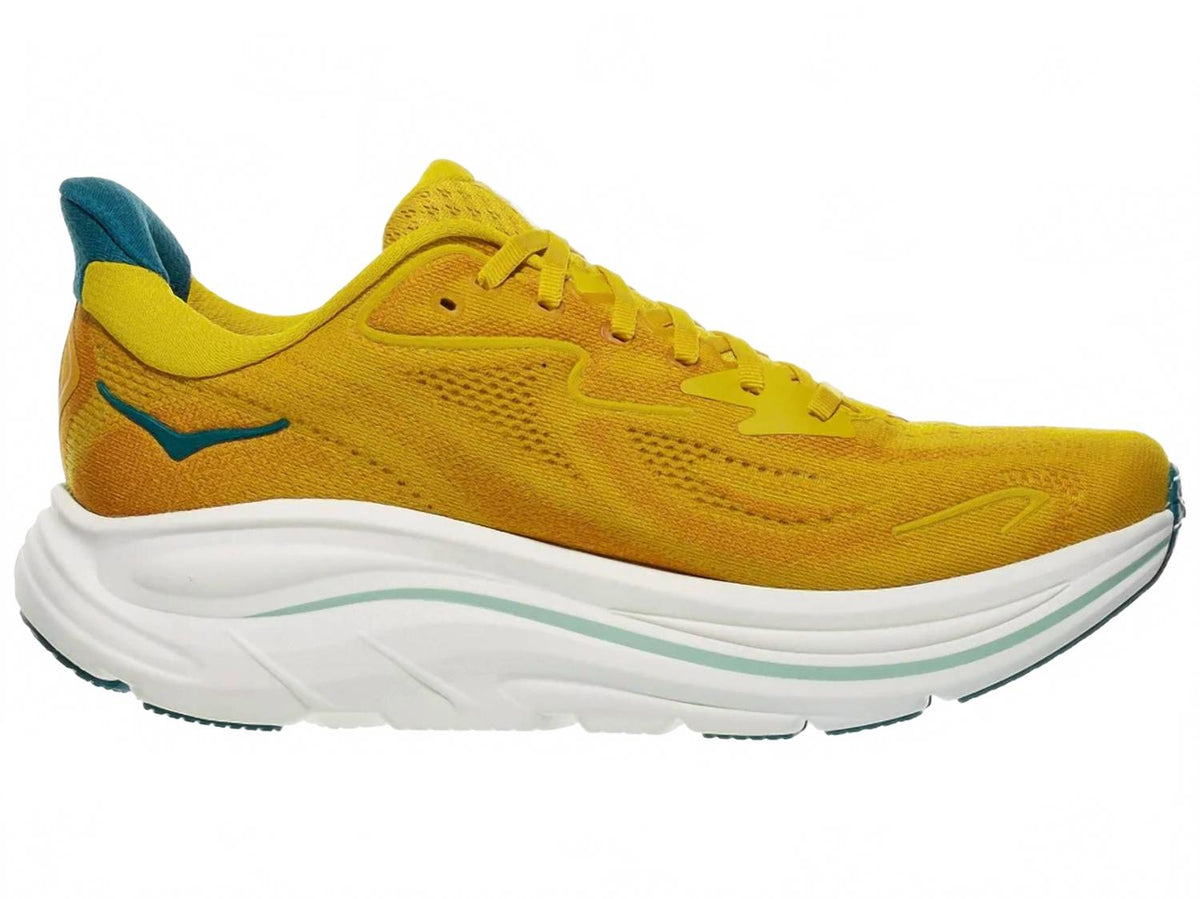 Tenis para correr de hombre color amarillo y dorado