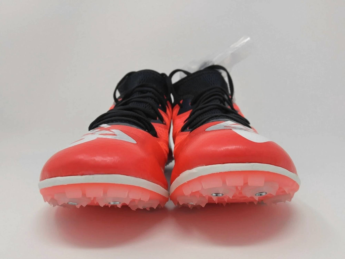 Zapatillas con clavos de mujer color rosado