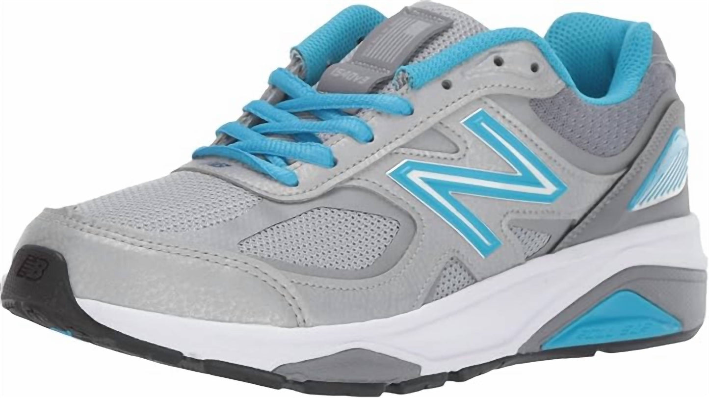 Tenis para correr de mujer color azul y plateado