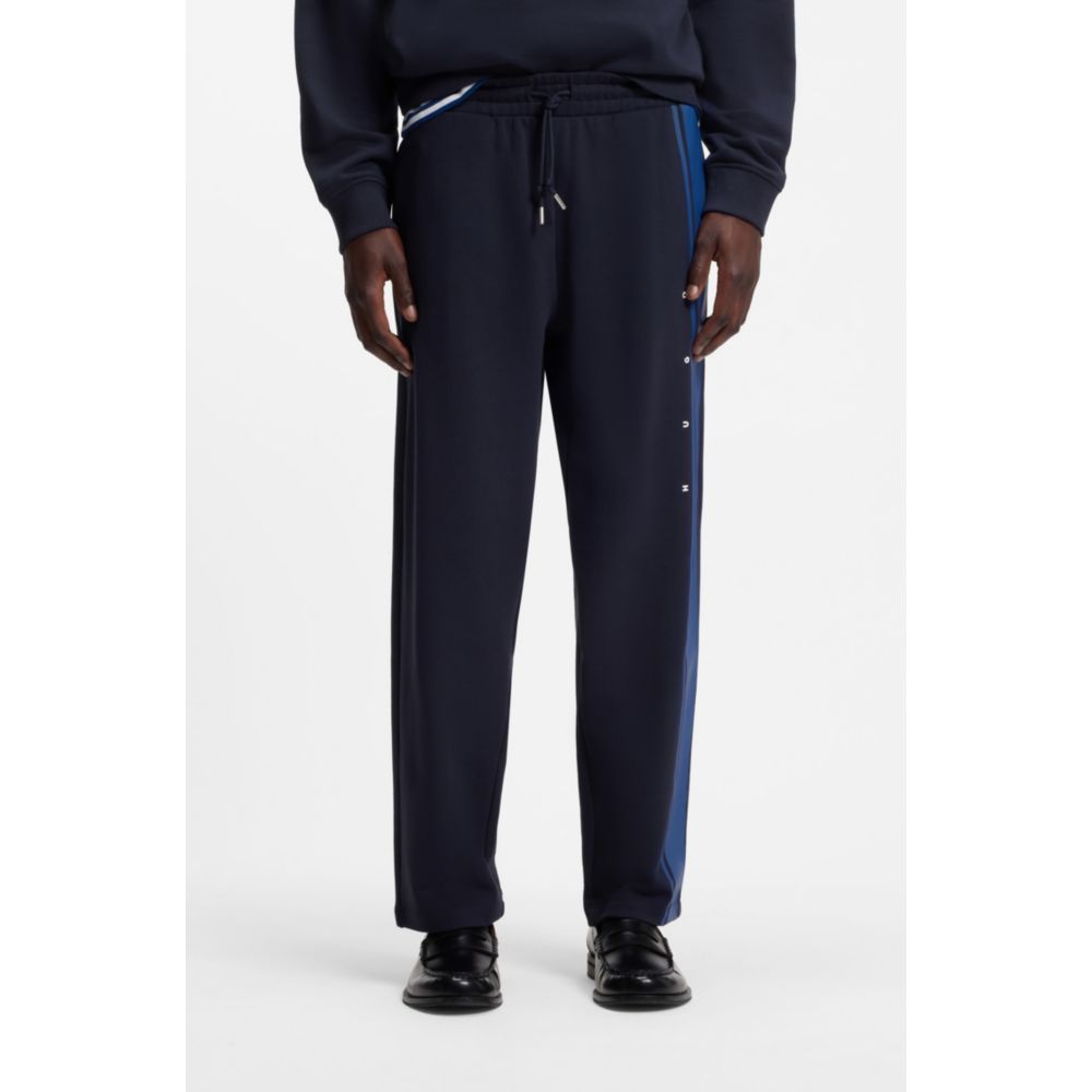 Pantalón deportivo de algodón de corte amplio a rayas