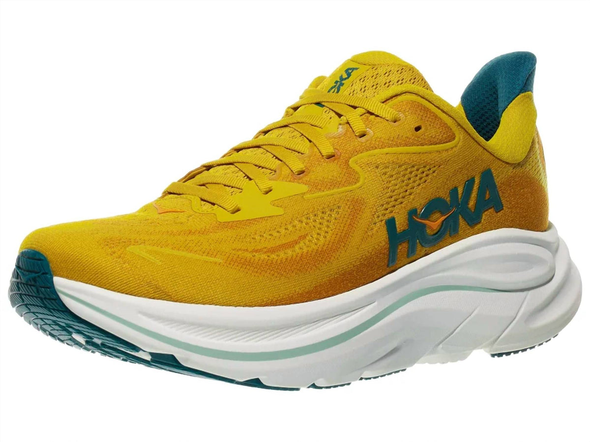 Tenis para correr de hombre color amarillo y dorado