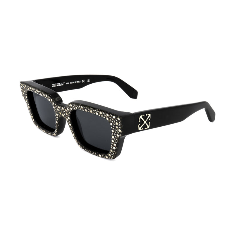 Gafas color negro y blanco y dorado