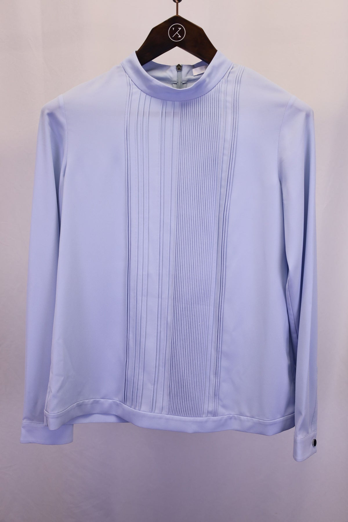 Top con cuello alto con pliegues color azul
