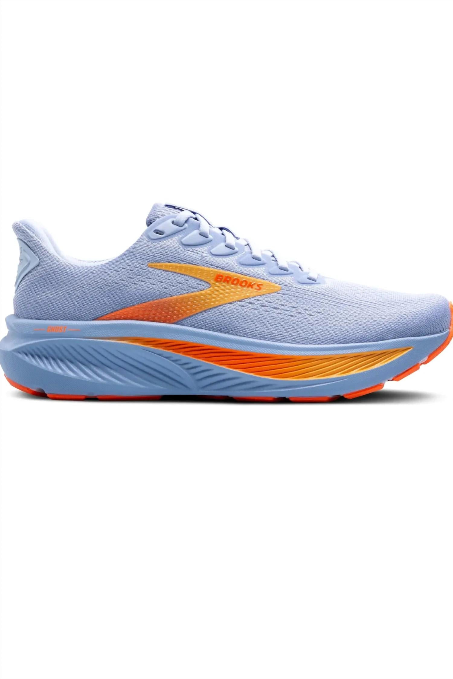 Tenis para correr de mujer color blanco y azul y naranja