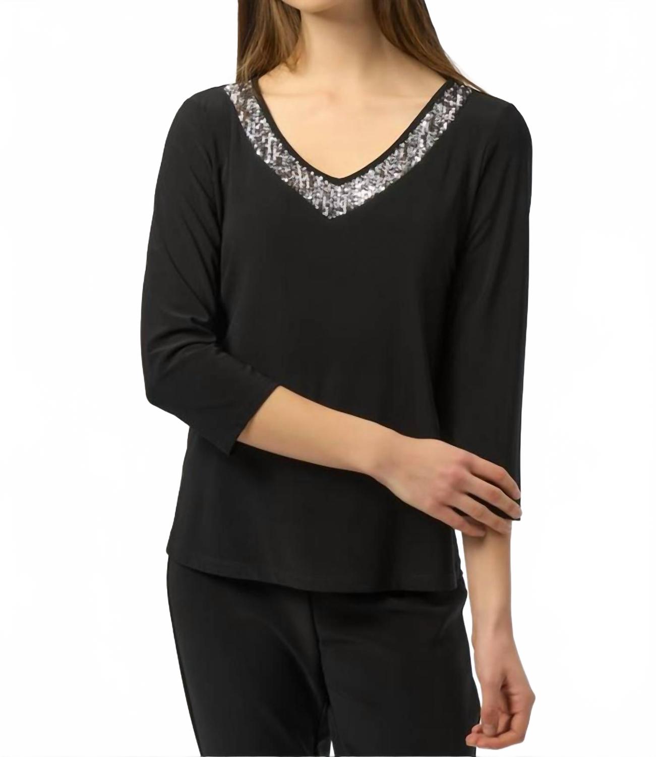 Suéter con cuello en V color negro y plateado