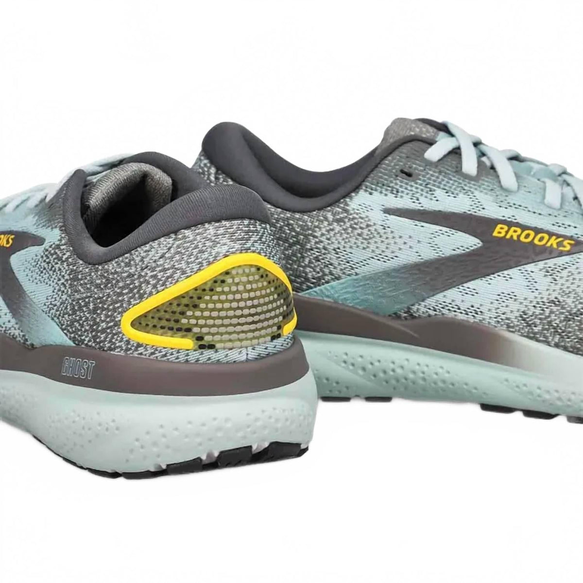 Tenis para correr de hombre color gris y dorado