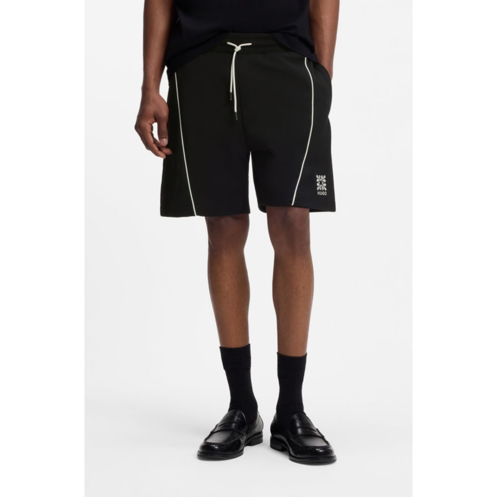 Short de mezcla de algodón con bordado