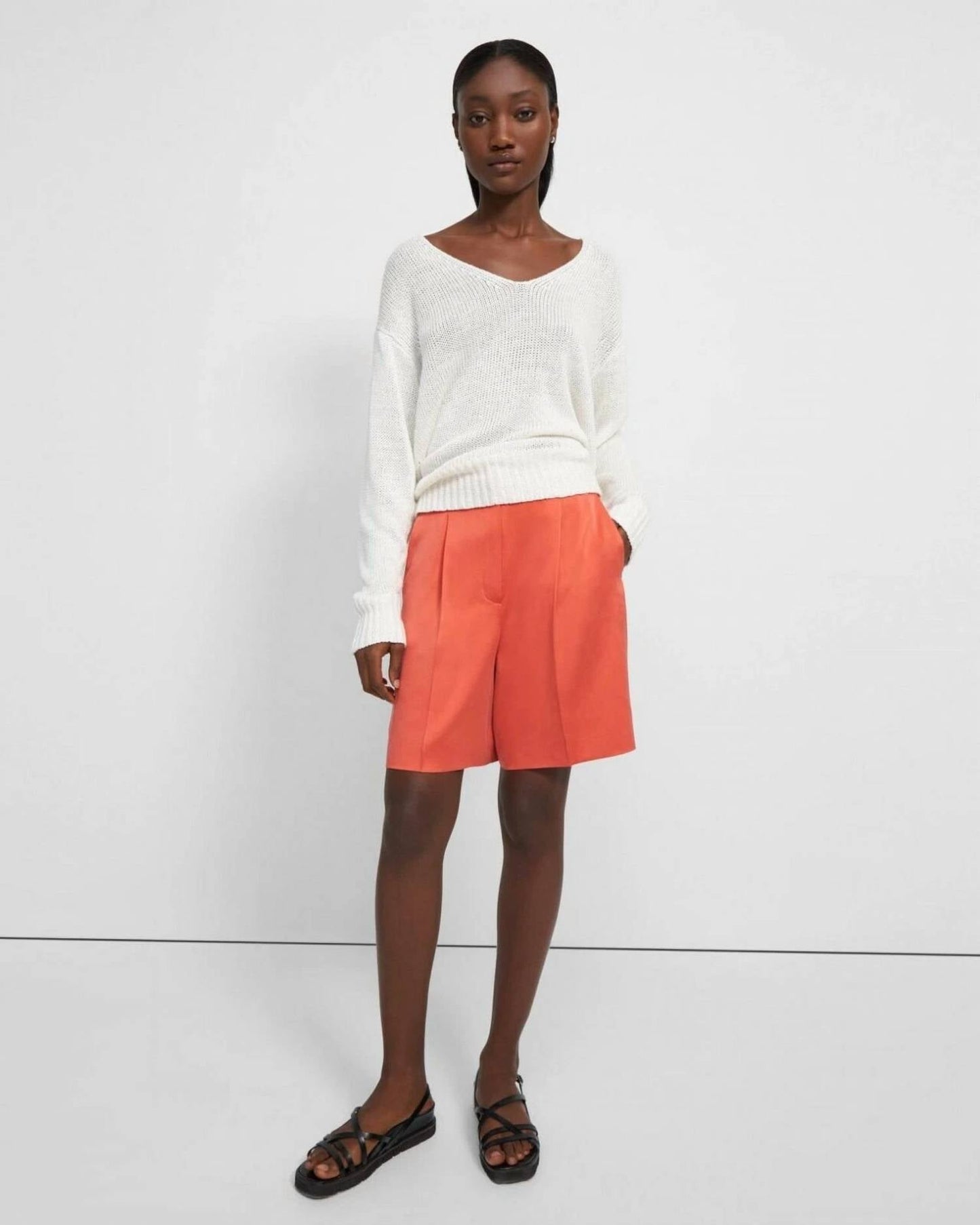 Short con pliegues