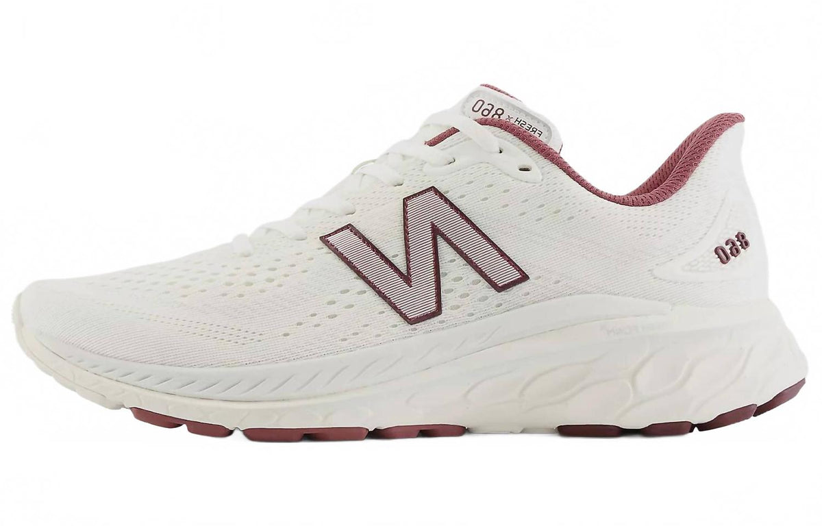 Tenis para correr de hombre color blanco y vinotinto