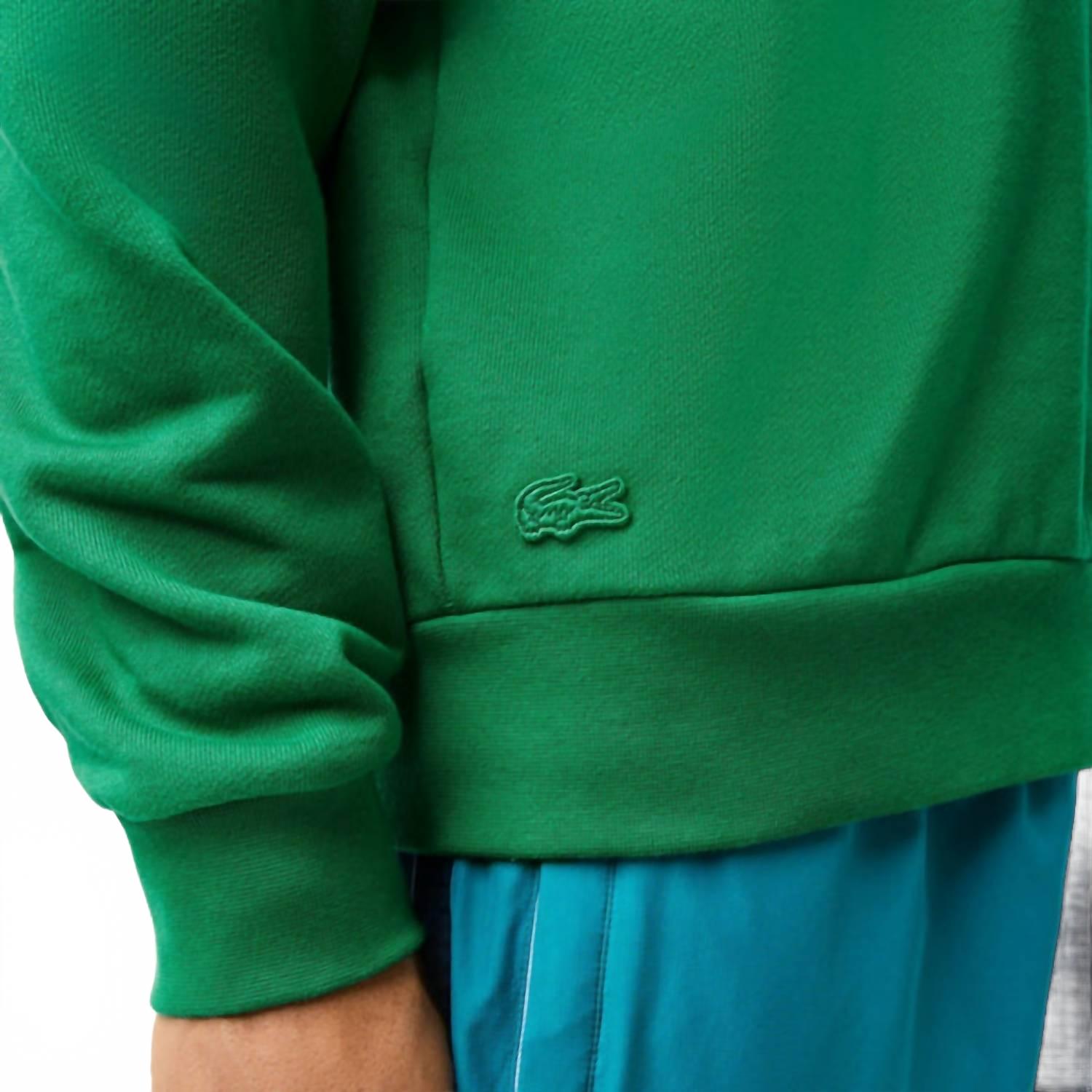 Buzo con cuello redondo color verde