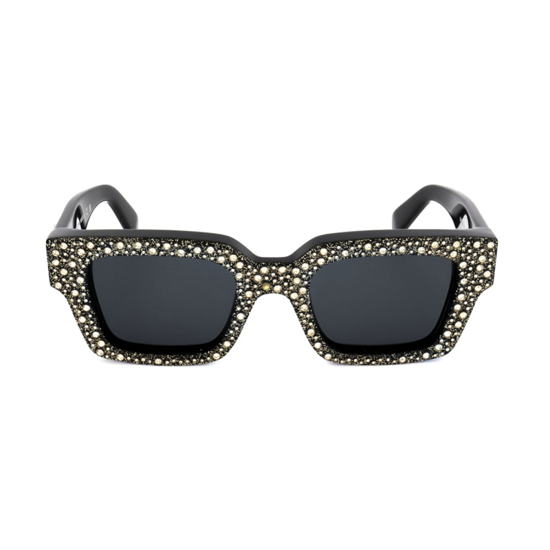 Gafas color negro y blanco y dorado
