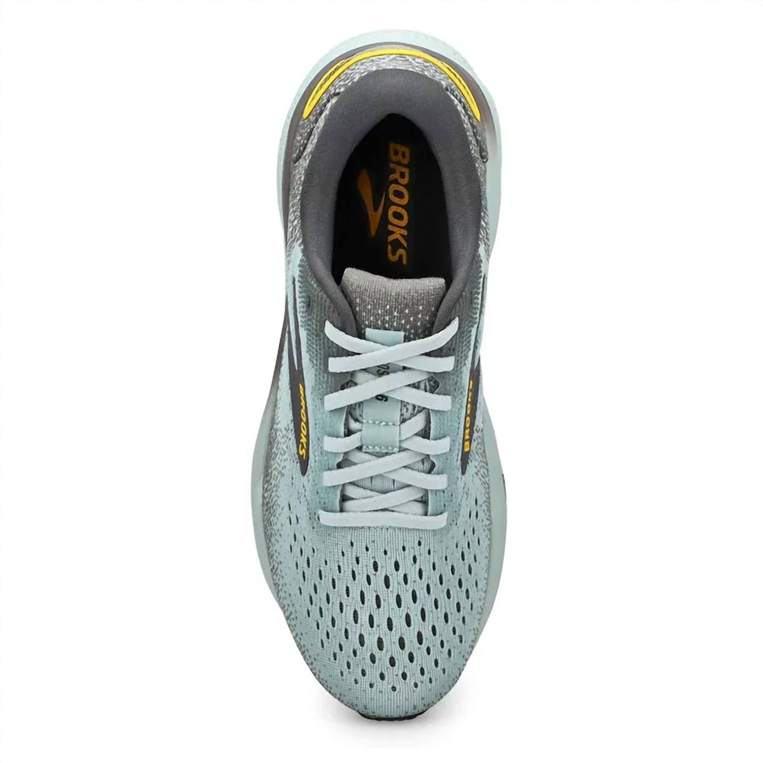 Tenis para correr de hombre color gris y dorado