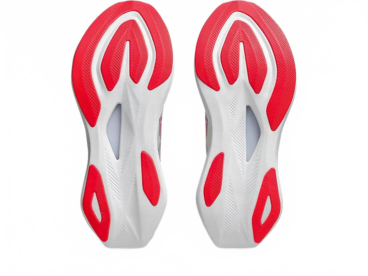 Tenis para correr de mujer color azul y crema