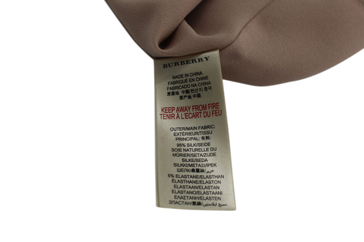 Blusa de seda sin mangas color beige