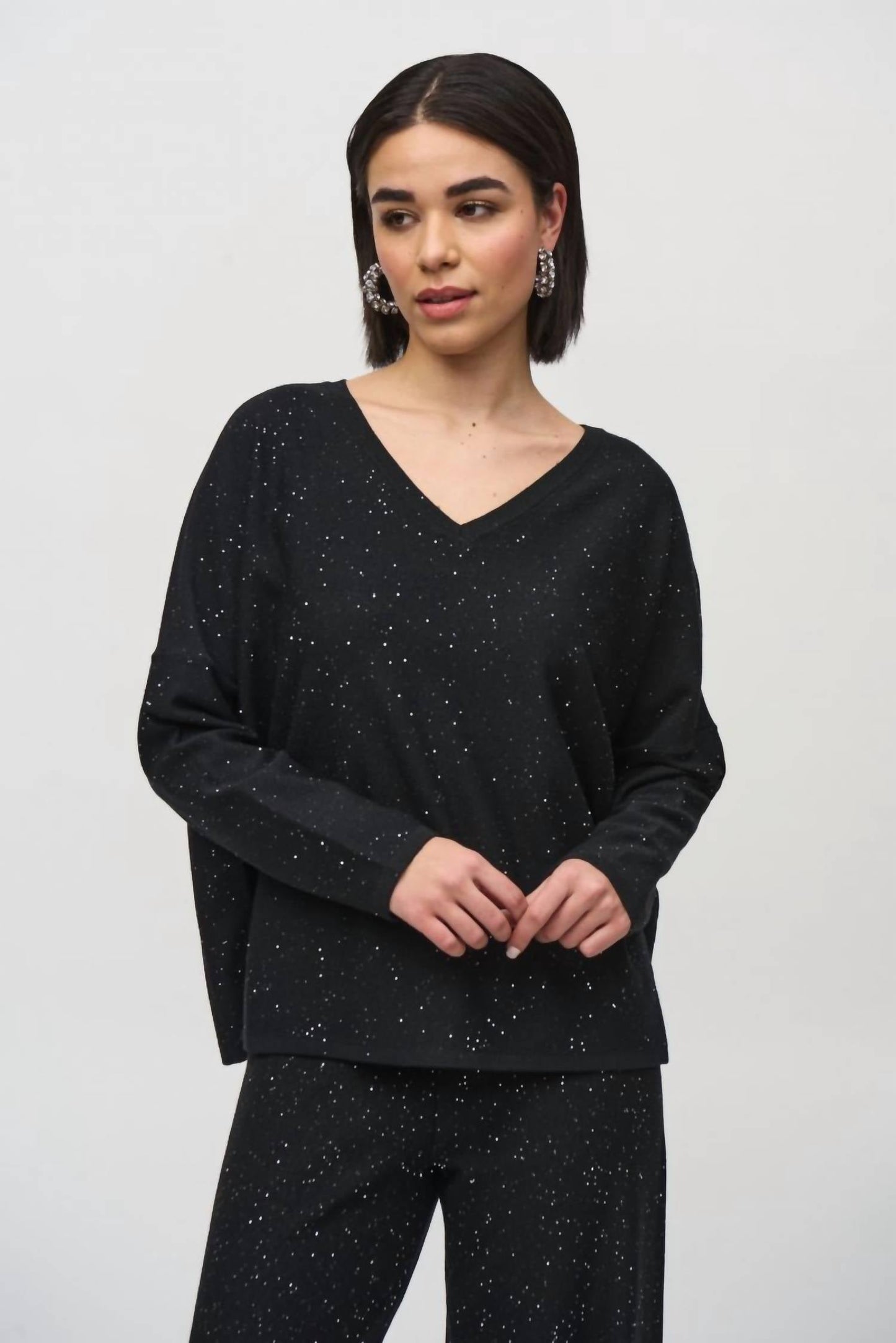 Top de mujer de manga larga con lentejuelas color negro
