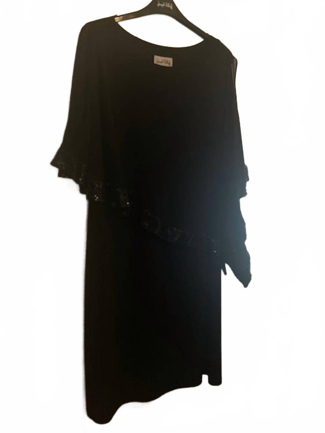 Vestido corto con lentejuelas color negro