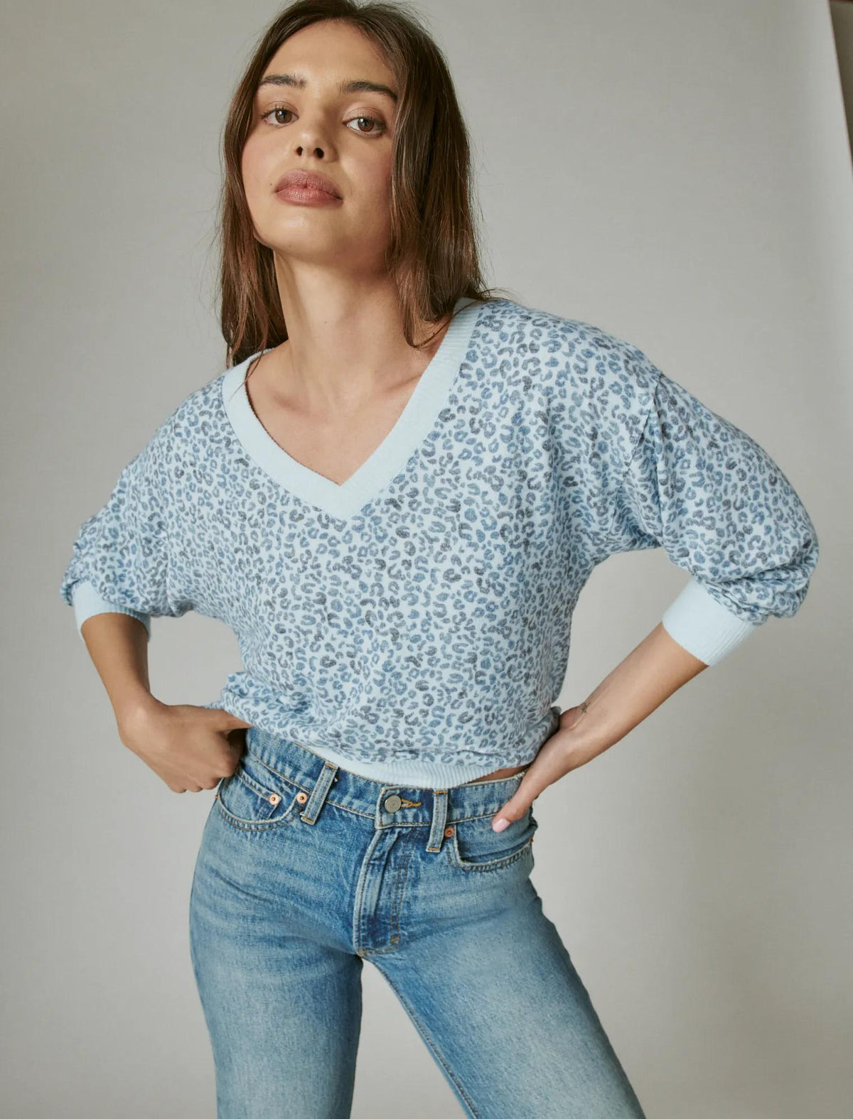 Top de mujer de manga larga con cuello en V